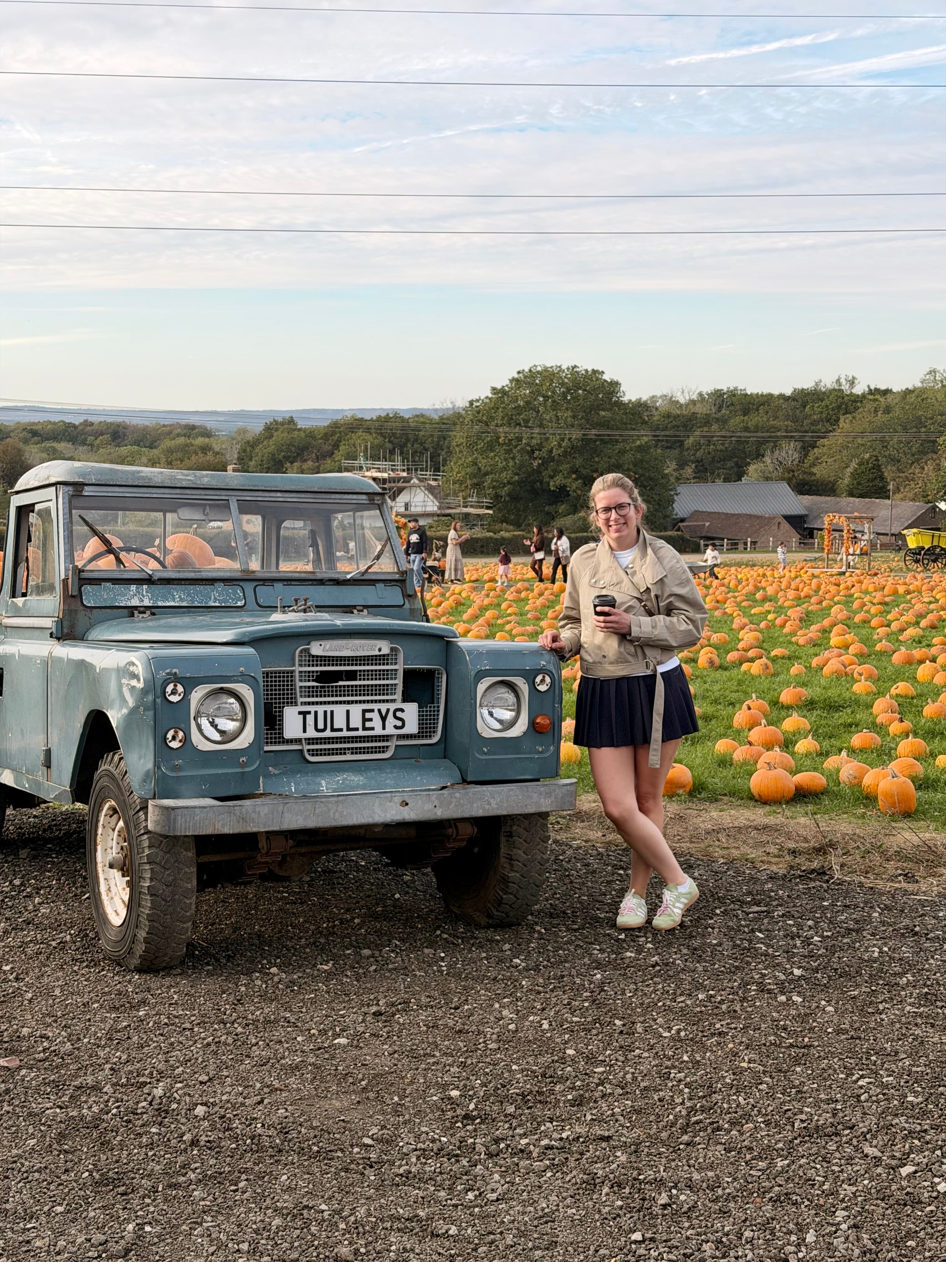 Leaning on the old blue Tulleys Land Rover by the pumpkin field