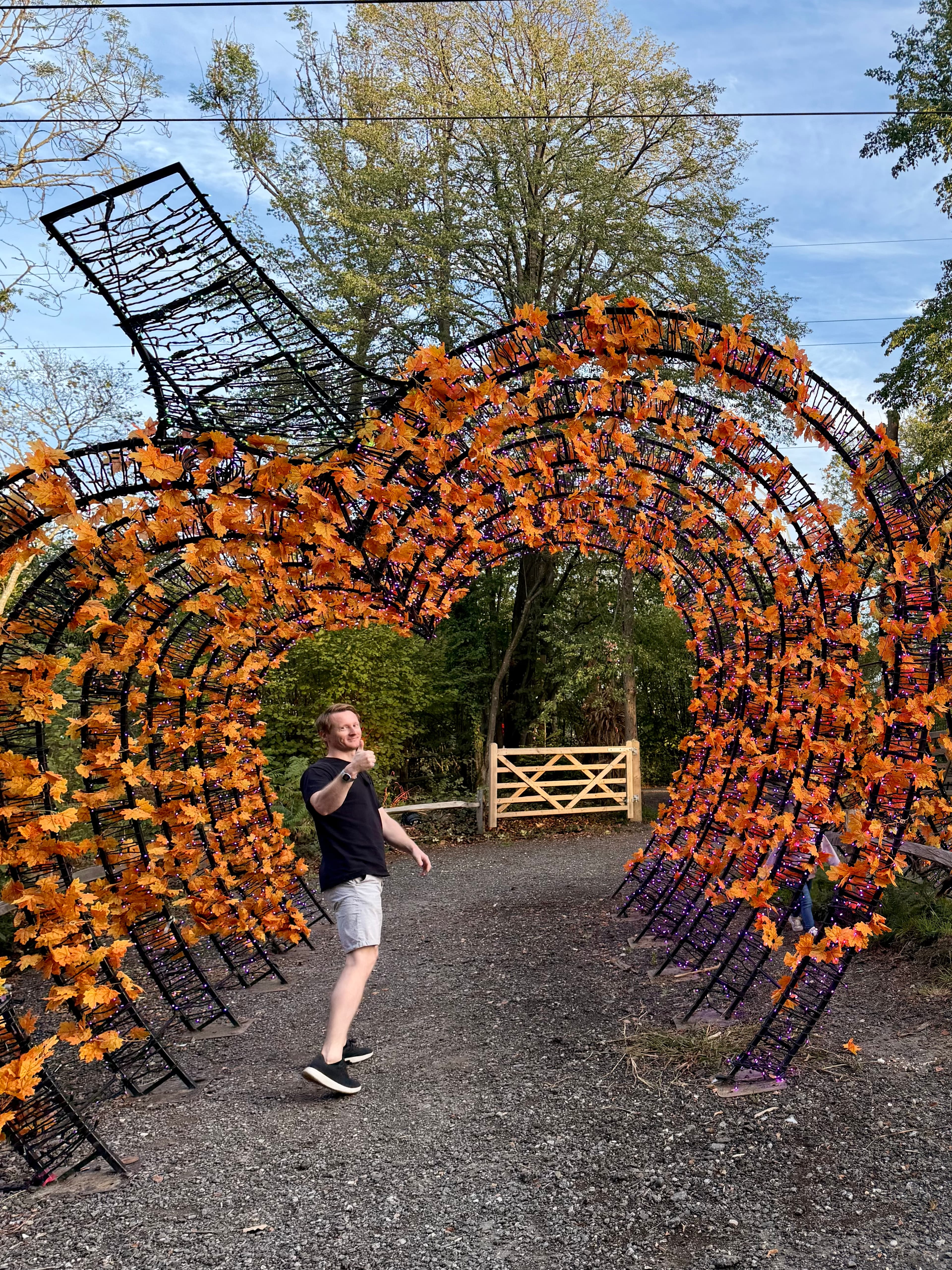 Walking through a spiral arch hung with copper leaves